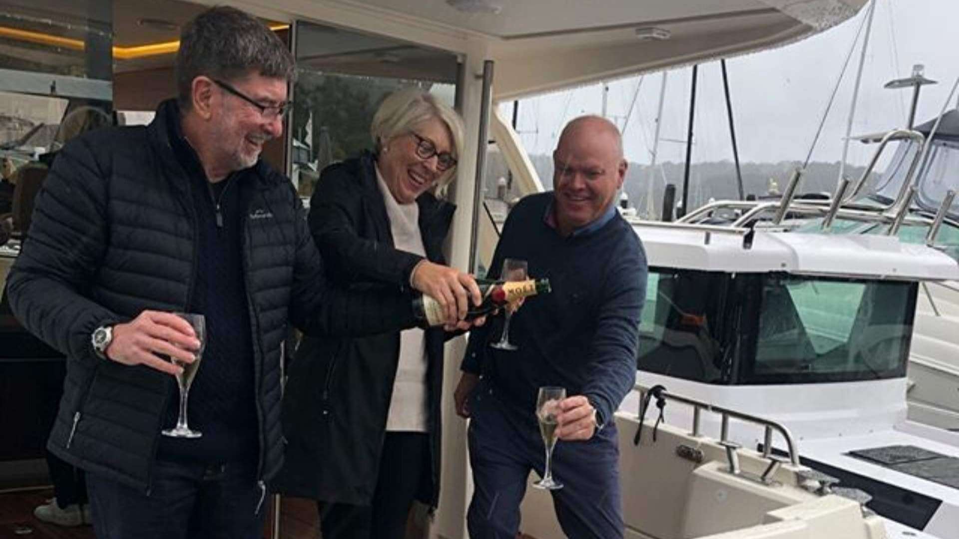 Untitled-design-78 Axopar customer new handover drinking champagne